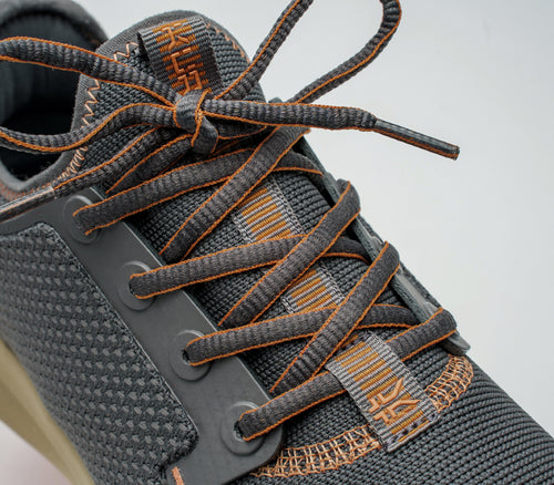 Close-up of the laces on the KURU Footwear ATOM Women's Athletic Sneaker in SmokeGray-PaleOrange