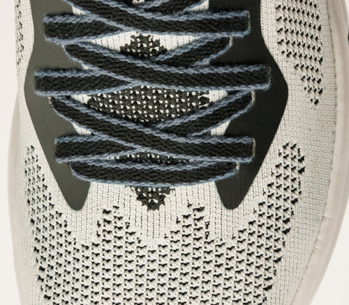 Close-up of the material on the KURU Footwear FLUX Men's Sneaker in JetBlack-BrightWhite