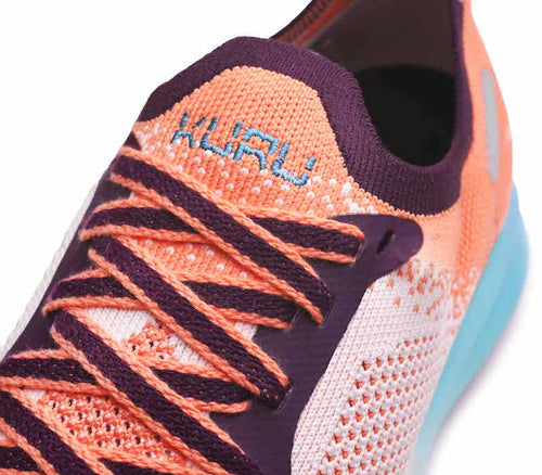 Close-up of the material on the KURU Footwear FLUX Women's Sneaker in OrangeSherbet-CalypsoBlue