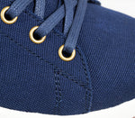 Close-up of the material on the KURU Footwear ROAM Women's Classic Court Sneaker in DeepNavy-White-MustangBrown