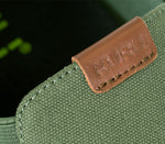Close-up of the material on the KURU Footwear PACE Men's Slip-on Shoe in OliveGreen-RichWalnut