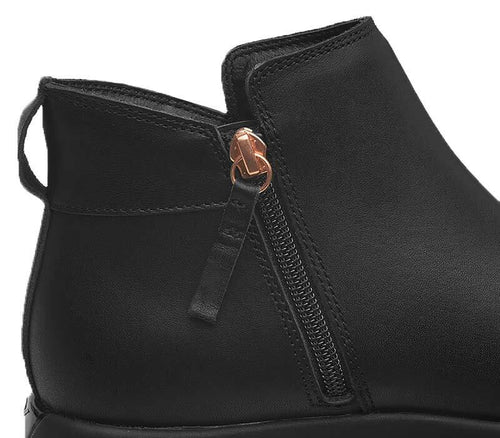 Close-up of the zipper on the KURU Footwear TEMPO Women's Ankle Boot in JetBlack-RoseGold