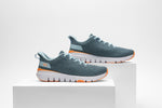 KURU Footwear FLEX Via sneakers in Mist Blue-Apricot viewed from the side, presented on two white cubes