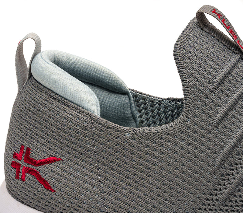 Close-up of the ankle on the KURU Footwear ATOM Slip-On Men's Sneaker in CloudGray-TangoRed