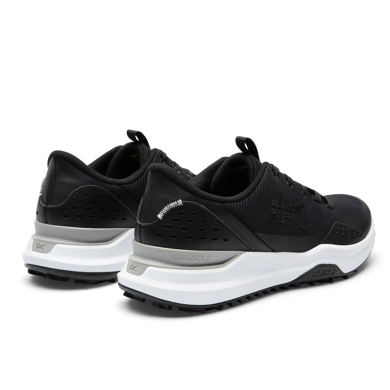 Black and white athletic shoes on a white background