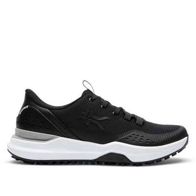 Black sneaker with white sole on a light gray background
