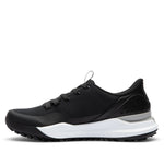 Black sneaker with silver accents on a light gray background