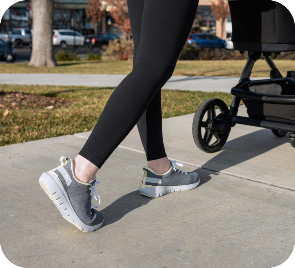 Person wearing KURU footwear while walking outdoors, designed to relieve fibromyalgia pain and support all-day comfort.