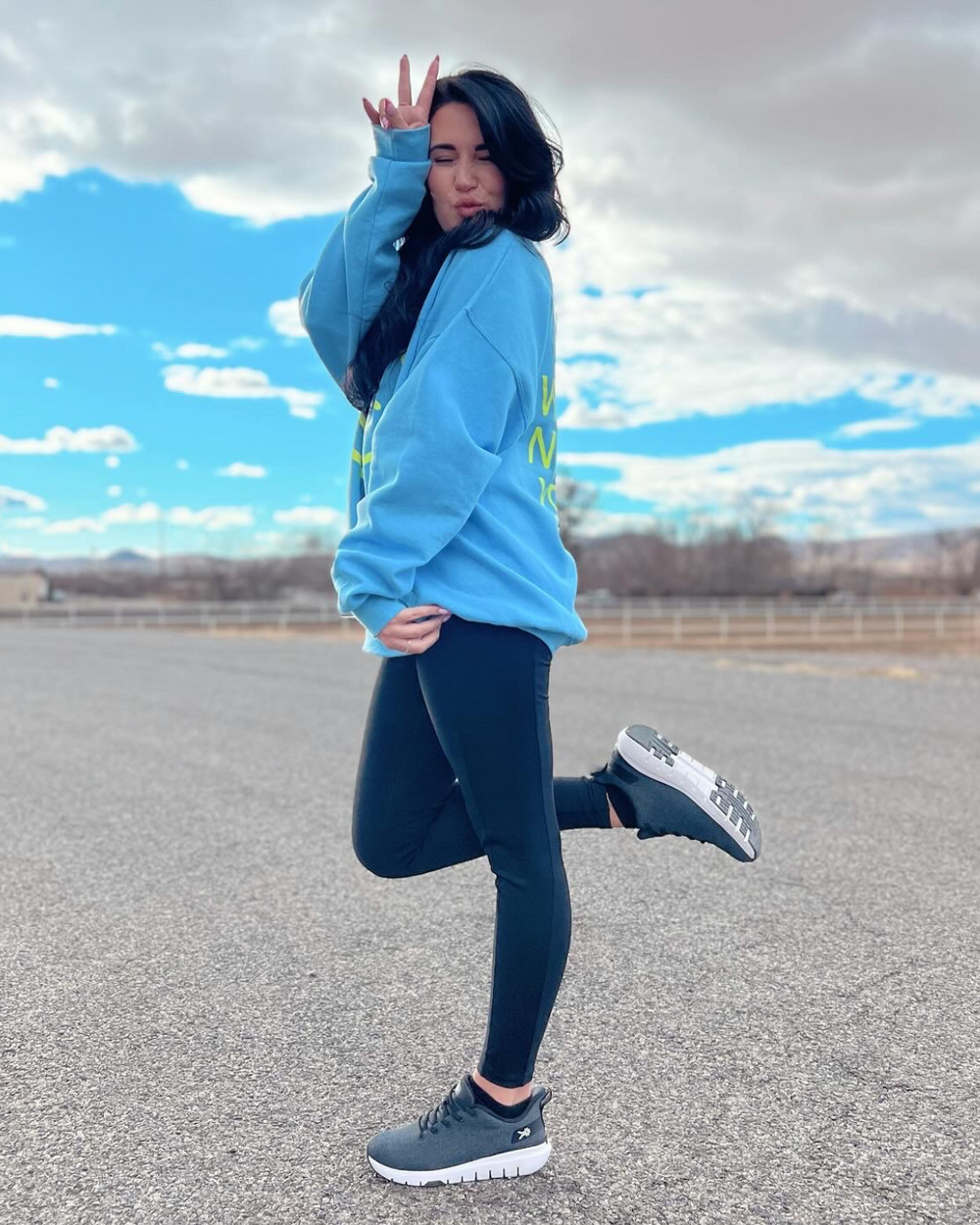 Woman posing and wearing KURU FLEX Via Women's shoes.