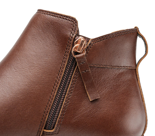 Close-up of the zipper on the KURU Footwear TEMPO Women's Ankle Boot in RichWalnut-Copper