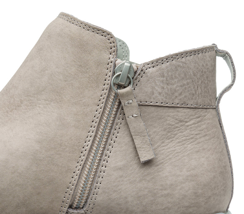Close-up of the zipper on the KURU Footwear TEMPO Women's Ankle Boot in WarmGray-Nickel