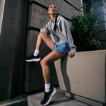Angled profile view of the KURU ATOM 2 Slip-On Women's Slip-On Sneaker in Jet Black-Dark Coral.