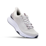 Angled side profile of the KURU ATOM 2 Waterproof Unisex Sneaker in Bone Gray-Lead Gray.