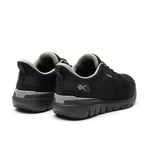 Close-up of the heel cup and KURUSOLE on the KURU FLEX Via Waterproof Unisex Sneaker in Jet Black-Tungsten Gray.