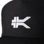 Close-up of the upper on the KURU Performance Hat Unisex Hat in Jet Black.