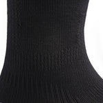 Close-up of the ribbed knit fabric on the KURU SPARC 2.0 Unisex Crew Sock in Black.