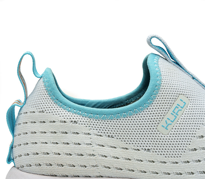 Close-up of the ankle on the KURU Footwear ATOM Slip-On Men's Sneaker in BrightWhite-TopazBlue