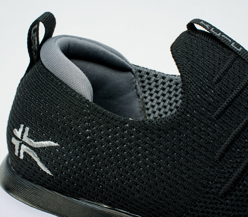 Close-up of the ankle on the KURU Footwear ATOM Slip-On Men's Sneaker in JetBlack-SlateGray