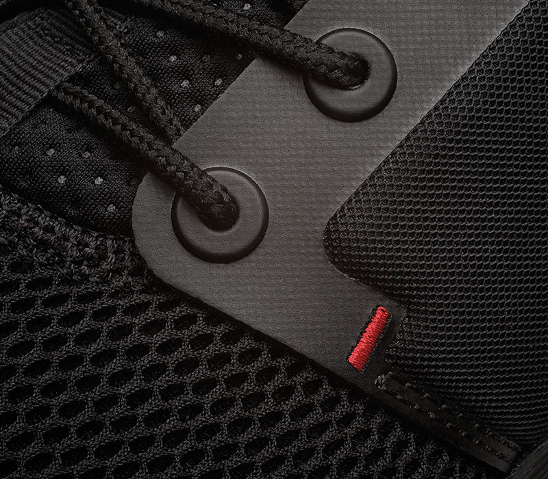 Close-up of the material on the KURU Footwear ATOM Men's Athletic Sneaker in JetBlack-White-FireRed