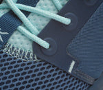 Close-up of the material on the KURU Footwear ATOM Women's Athletic Sneaker in TidalWave-White-OasisBlue