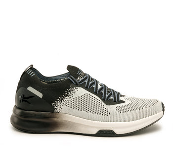 Outside profile details on the KURU Footwear FLUX Men's Sneaker in JetBlack-BrightWhite