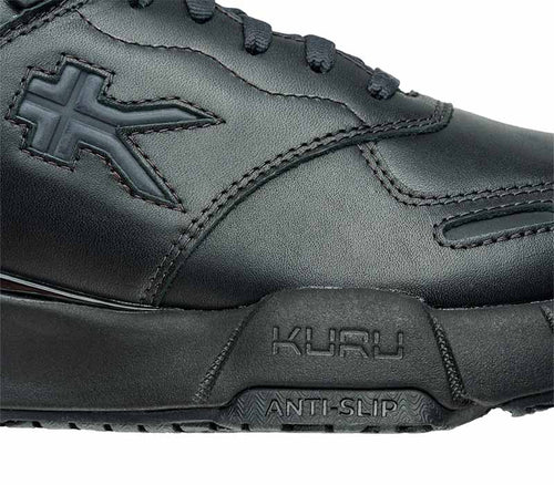 Close-up of the side of the KURU Footwear KINETIC 2 WIDE Women's Anti-Slip Sneaker in SmokestackBlack