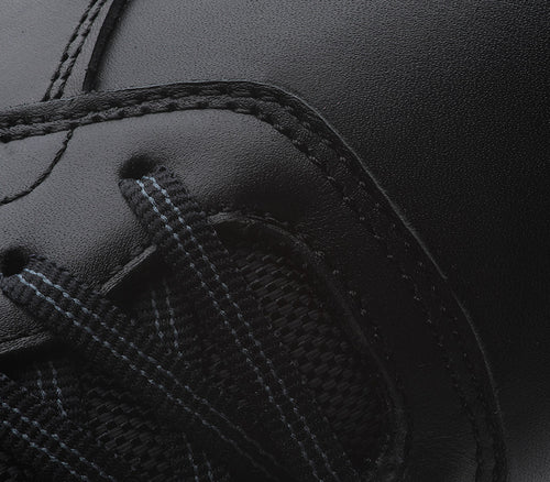 Close-up of the material on the KURU Footwear KINETIC Women's Anti-Slip Sneaker in RiveterBlack