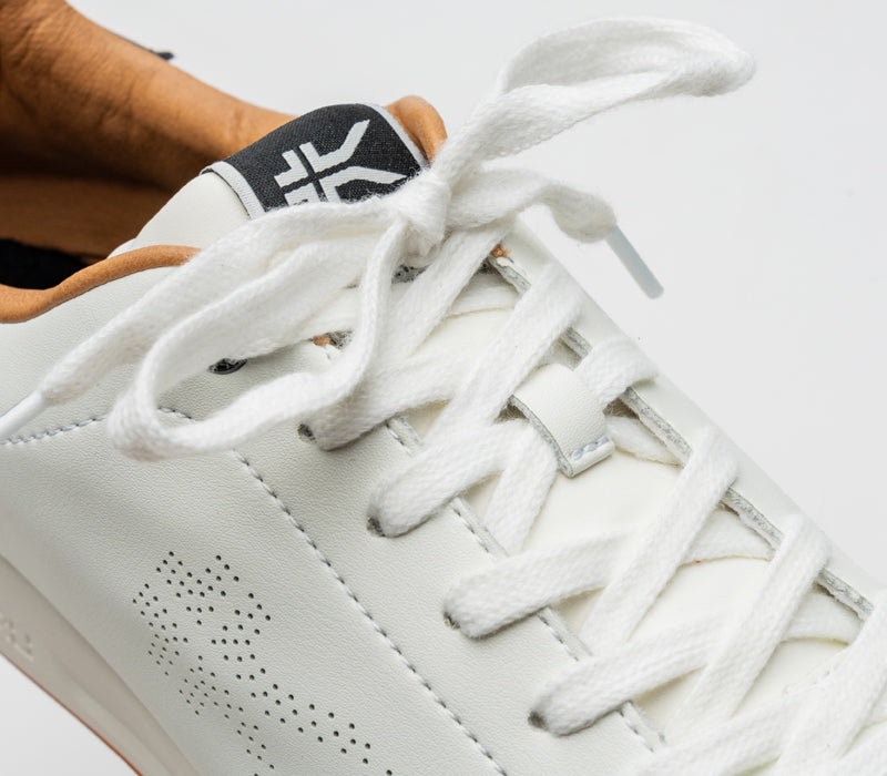 Close-up of the laces on the KURU Footwear ROAM Women's Classic Court Sneaker in BrightWhite-JetBlack