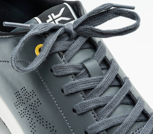 Close-up of the laces on the KURU Footwear ROAM Men's Classic Court Sneaker in EmpireSteel-GoldenYellow