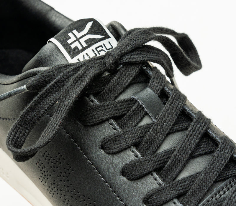 Close-up of the laces on the KURU Footwear ROAM Men's Classic Court Sneaker in JetBlack-BrightWhite