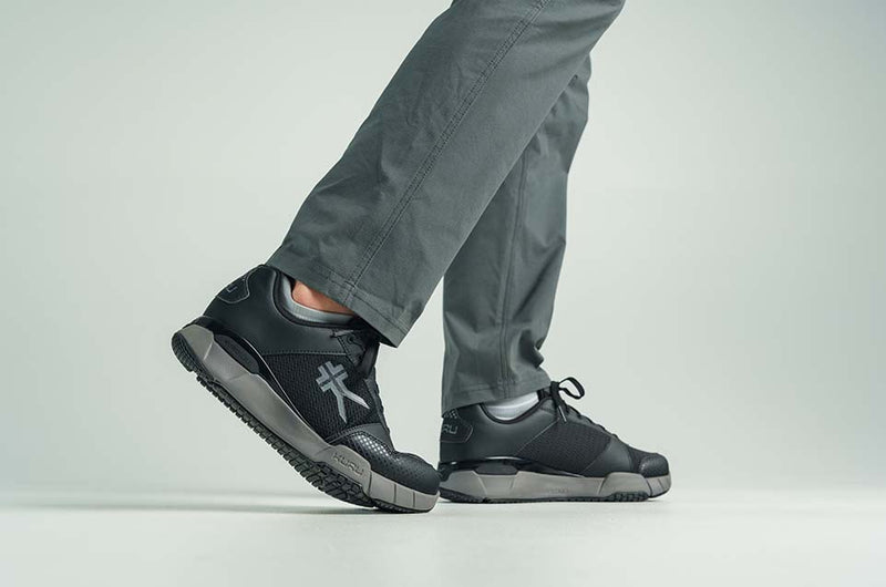 KURU Footwear man walking in QUANTUM shoes in the color JetBlack