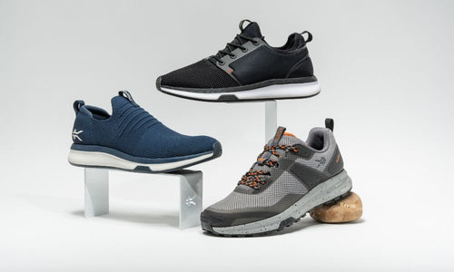 KURU Footwear Men's ATOM Collection shoes staggered by ATOM in JetBlack-White-FireRed, ATOM SLIP-On in  MidnightBlue-MineralBlue, and ATOM Trail in LeadGray-OrangeSpice.