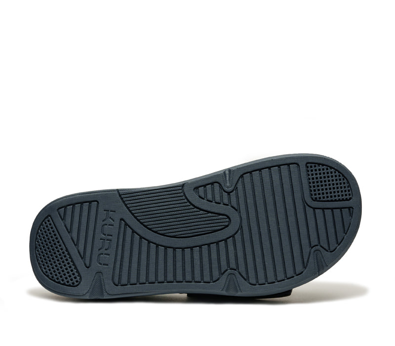 Close-up of the bottom of the heel on the KURU Footwear MOMENT Men's Sandal in Midnight Blue/Pale Lime