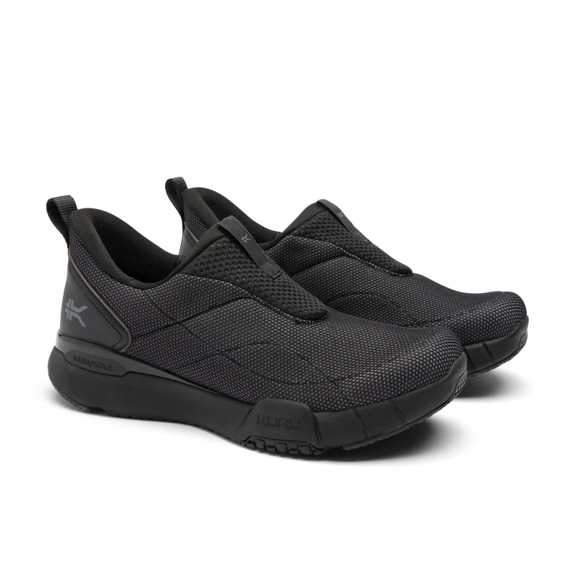 Black slip-on shoes on a white background