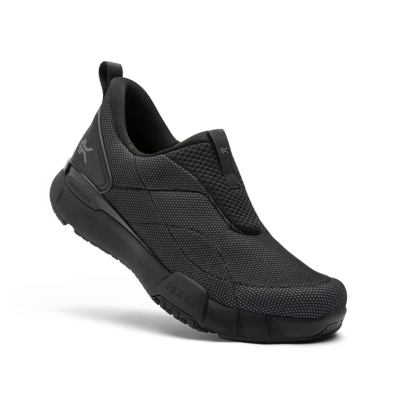 Black slip-on shoe with brand logo on a white background