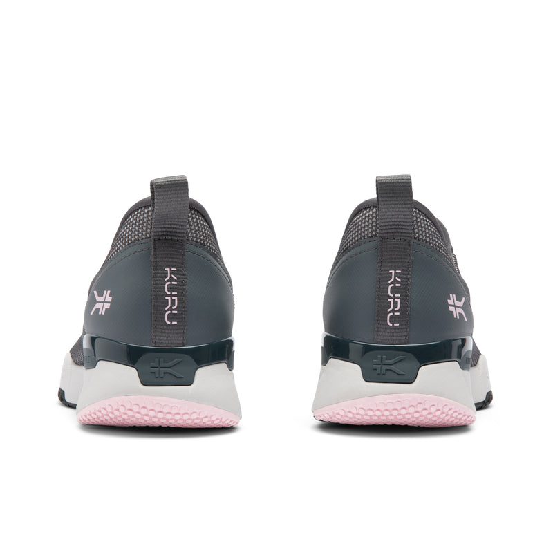 Pair of gray and pink athletic shoes with 'Kuru' branding on a white background