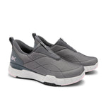 Pair of gray slip-on shoes with white soles on a white background