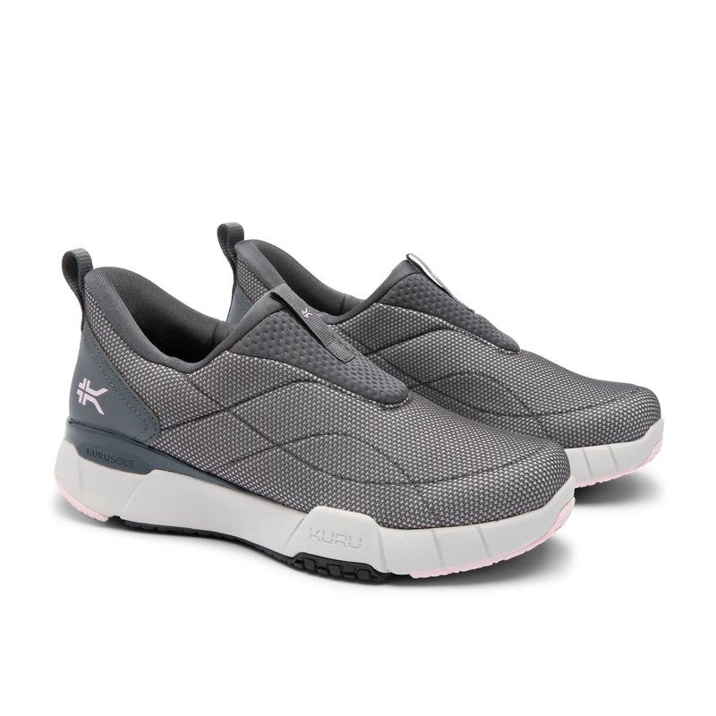 Pair of gray slip-on shoes with white soles on a white background