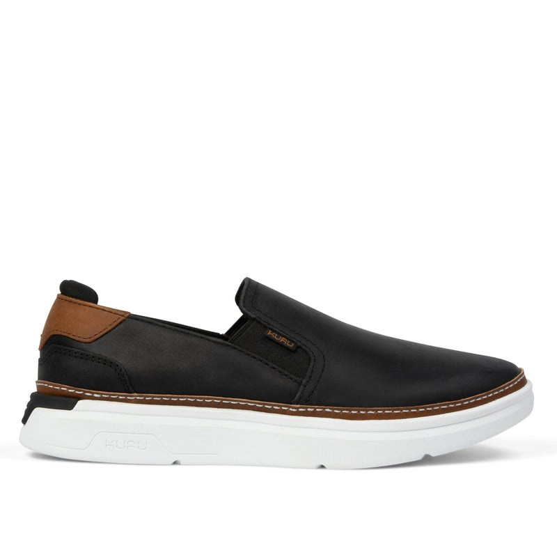 Black slip-on shoe with brown accents on a white background