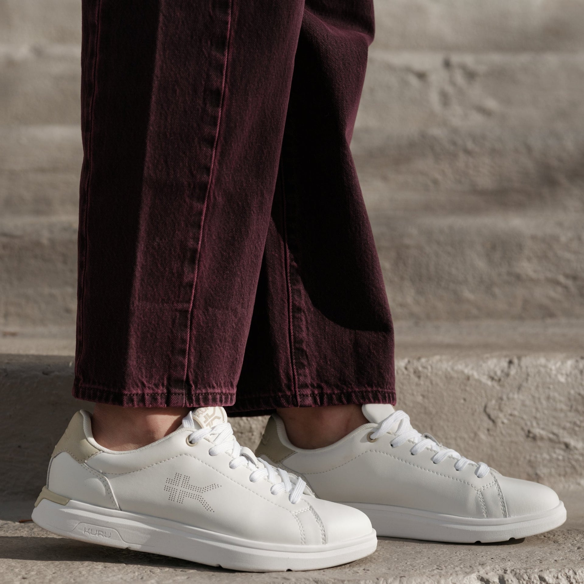 Woman wearing KURU ROAM 2 Women's shoes in Bright White/Sand outdoors.