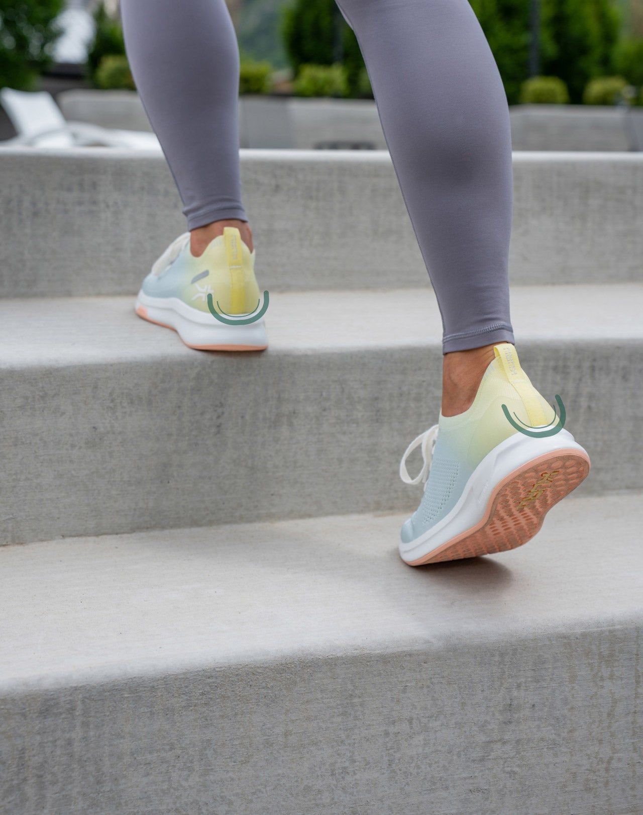 Woman exercising outdoors, climbing stairs and wearing shoes by KURU Footwear.