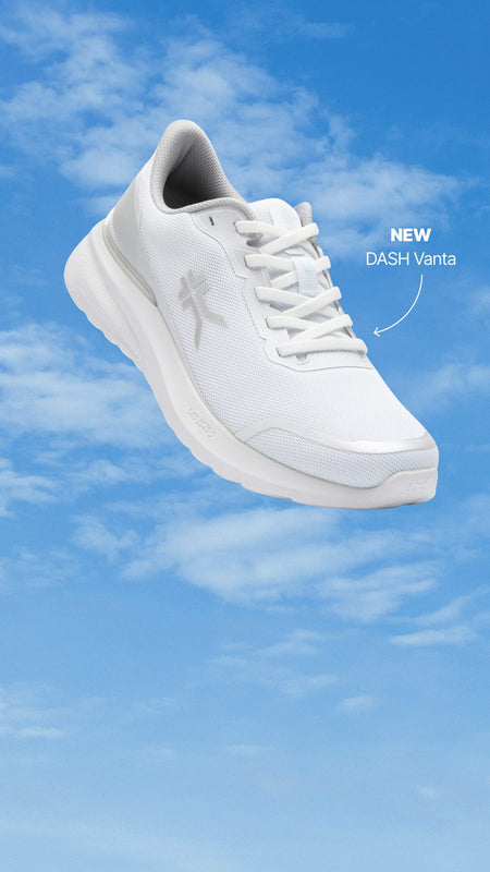 KURU DASH Vanta unisex running shoe in BrightWhite-Silver against a cloudy blue sky, labeled "New: DASH Vanta"