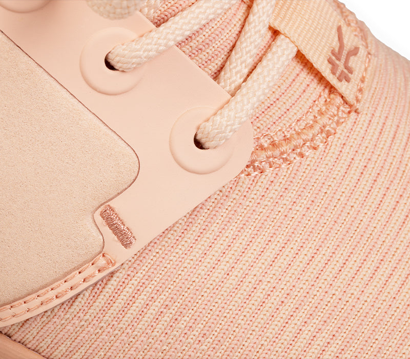 Close-up of the material on the KURU Footwear ATOM Women's Athletic Sneaker in PinkSand-White-ClayPink