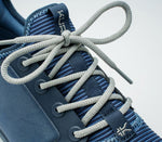 Close-up of the laces on the KURU Footwear ATOM WIDE Men's Athletic Sneaker in MidnightBlue-StormGray